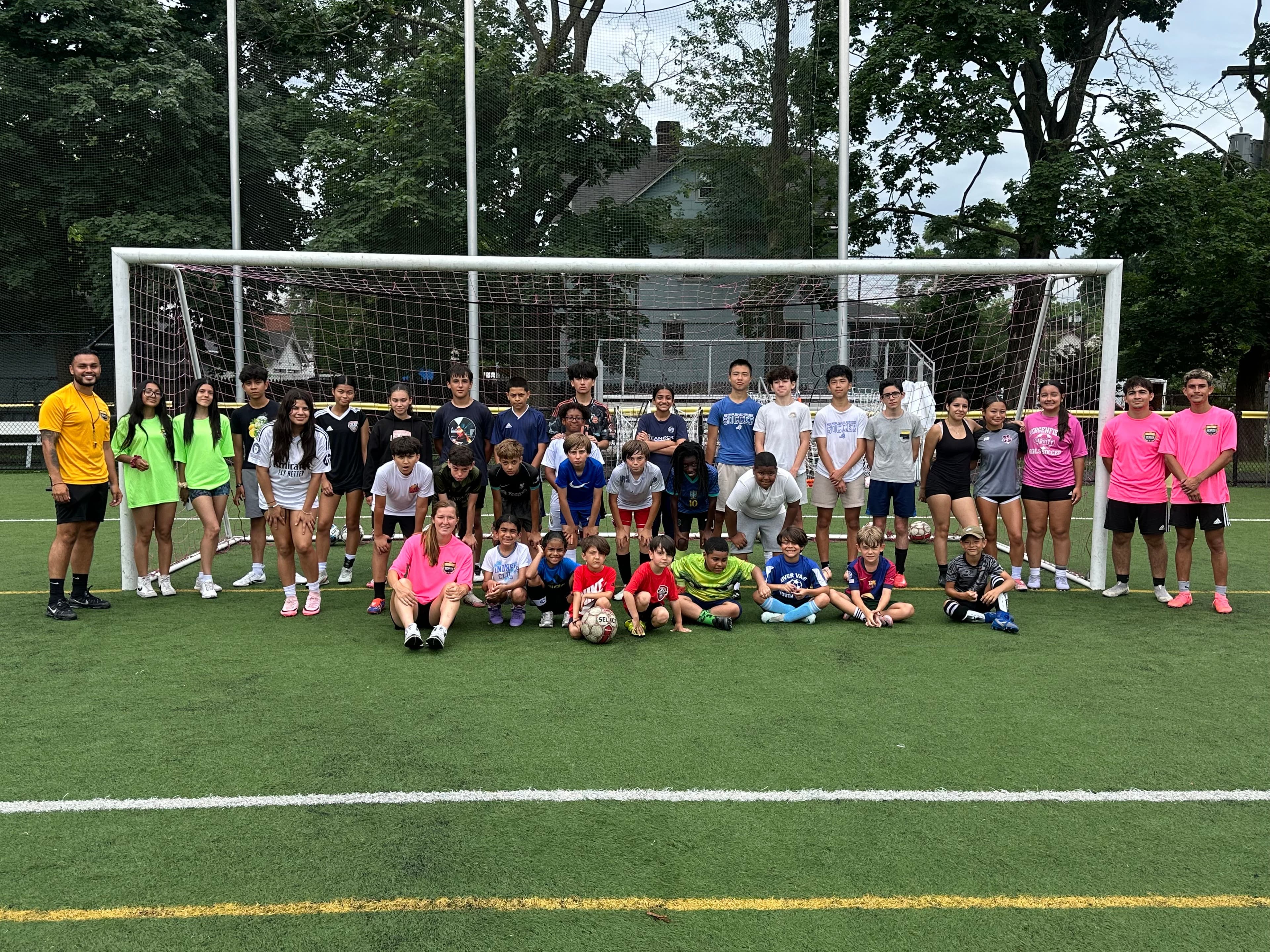 Soccer camp group photo with coaches and campers